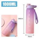 Gradient pink and purple water bottle with measurement markings and a strap, displayed with dimensions.