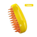 Yellow scalp massager with orange bristles on a white background