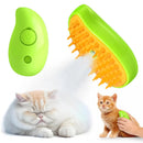 Pet grooming tool with green and orange design, featuring a cat and kitten on a white background.