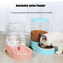 Pet water and food dispenser with a cat eating from it on a light wood floor.