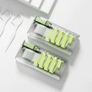 Two boxes of dental floss with green handles on a white background
