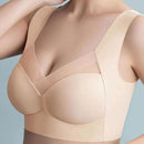 Beige bra worn by a model on a light gray background