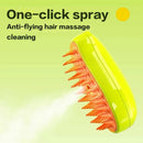 Green hair massage cleaning device with orange bristles on a light green background