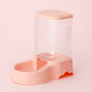 Pink pet feeder and water dispenser on a light pink background